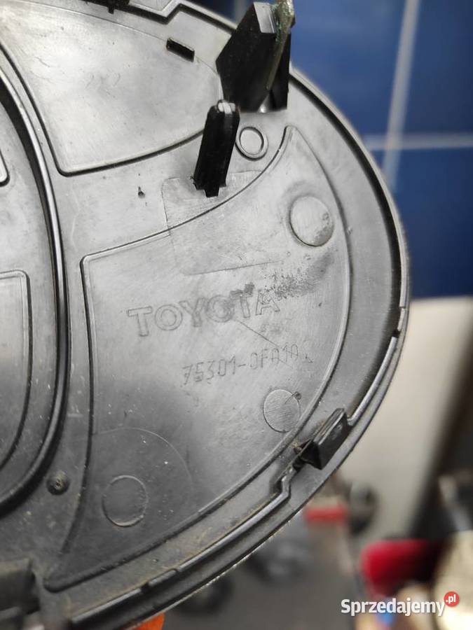 COROLLA VERSO II ZNACZEK EMBLEMAT ZDERZAKA PRZÓD Olsztyn