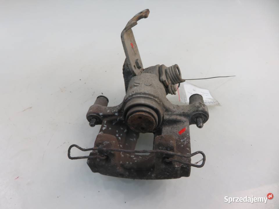 ZACISK LEWY TYŁ NISSAN PRIMERA P12