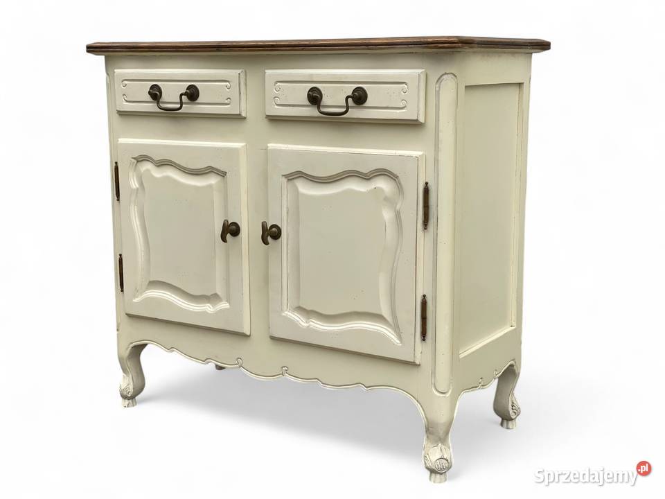 Urokliwa biała komoda rustykalna na giętych