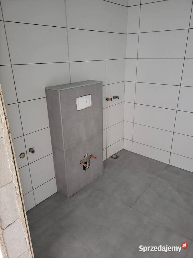 Układanie płytek usługi glazurnicze tanio Kafelkowanie