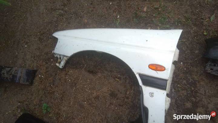 Błotnik przedni lewy FORD ESCORT 9500 biały bez Karoseria Margonin