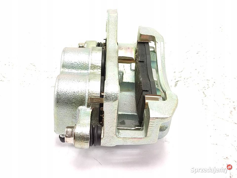 ZACISK HAMULCOWY LEWY PRZÓD KIA CARNIVAL UP GQ