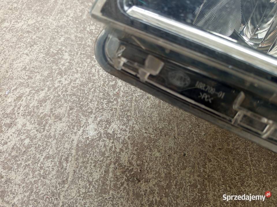 Reflektor lewy Trafic Vivaro hella orginalny