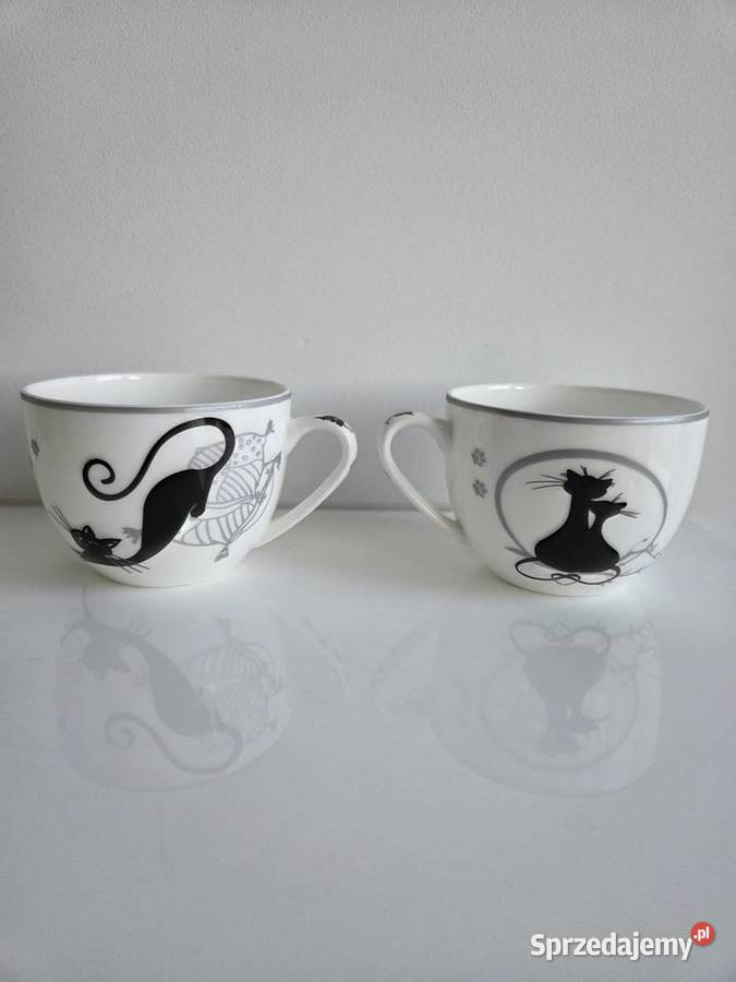 2 białe filiżanki w czarne koty ze spodkami Liszki