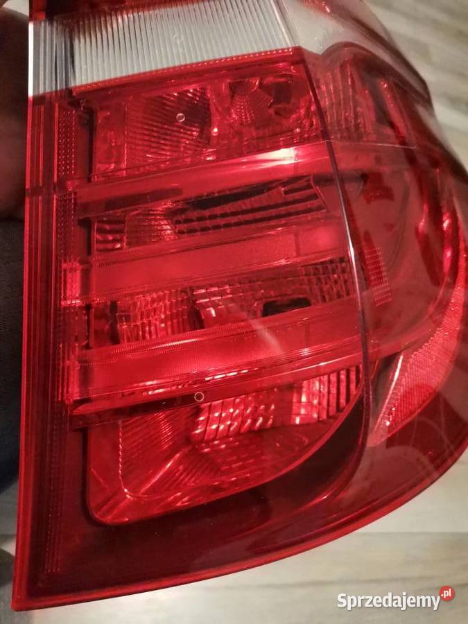 BMW X3 F25 1015 PRAWA LAMPA W BŁOTNIK TYŁ osobowe Części samochodowe Międzychód