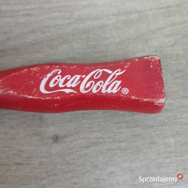 Stary drewniany otwieracz do butelek CocaCola
