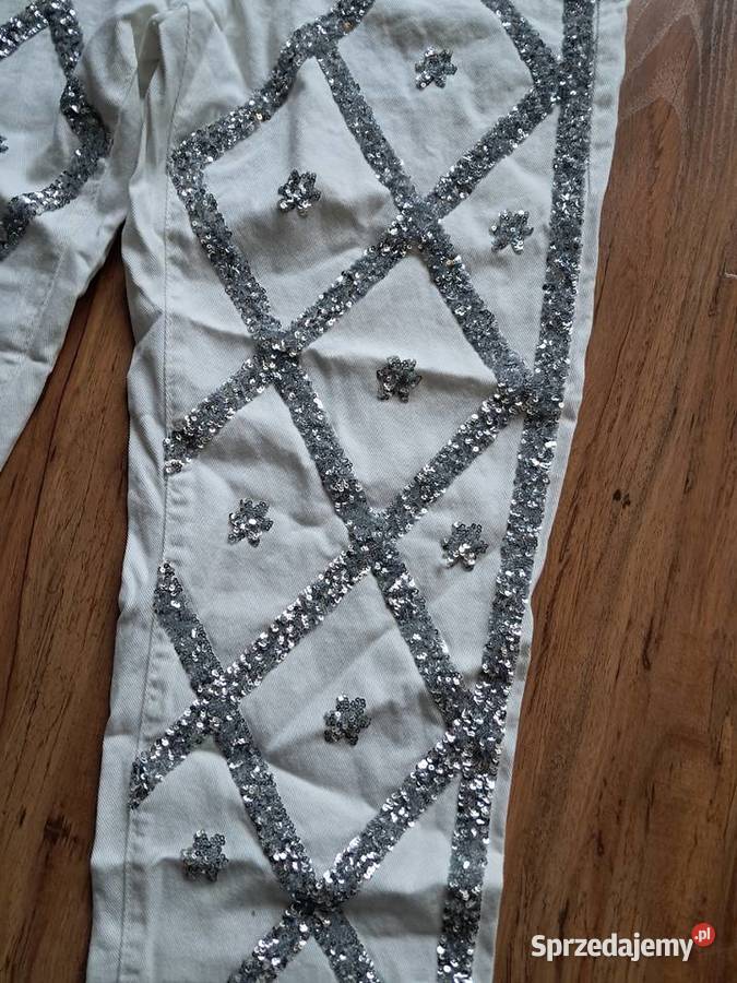 nowe białe spodnie z cekinami rozmiar L 74