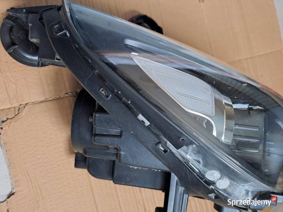 Uszkodzony reflektor lampa 92102 G4060 prawy Łódź