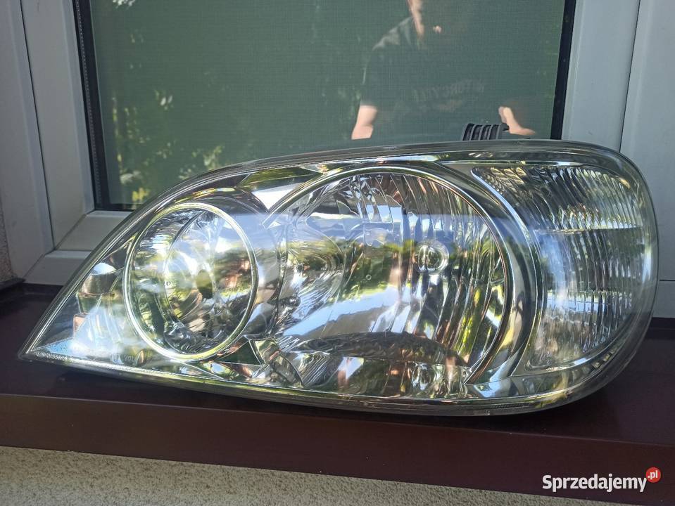 Kia Carnival 1 I lampa przednia lewa reflektor osobowe Motoryzacja Sieradz