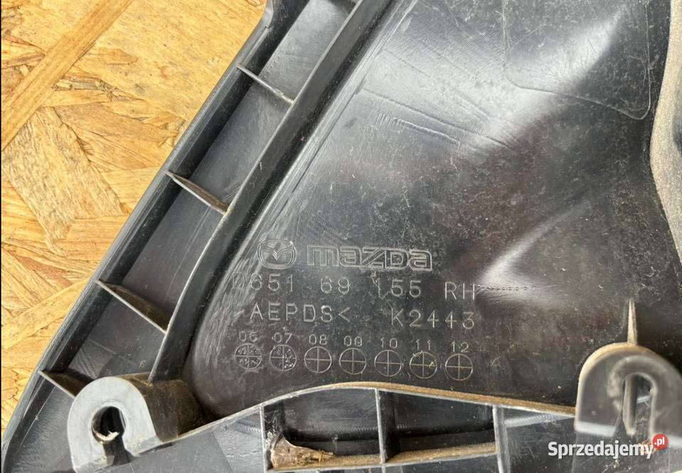 OSŁONA BŁOTNIK PRAWY PRZÓD MAZDA II 2 D65169155