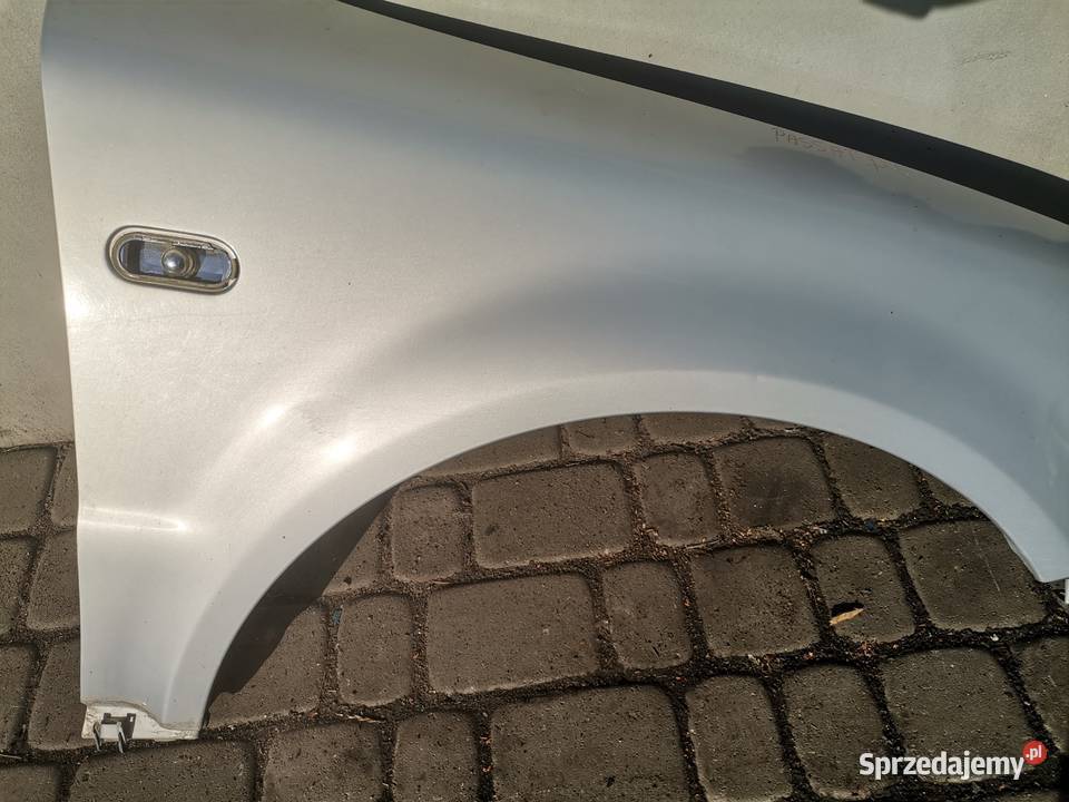 BŁOTNIK PRAWY PRZÓD VW PASSAT B5 LB7Z Nowy Sącz