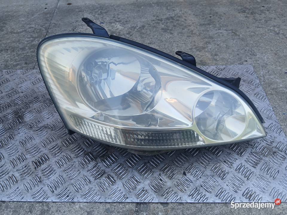 Lampa prawa przednia Toyota Avensis Verso 0103r Lampy przednie Radłów