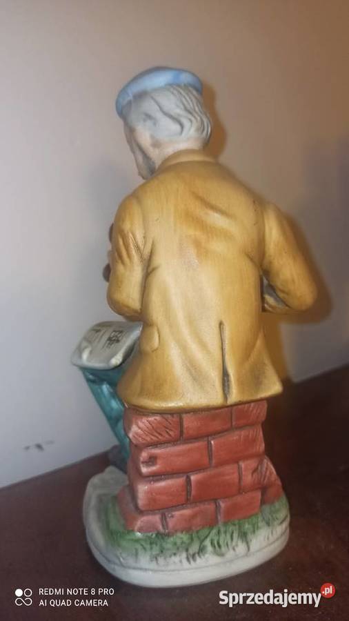 Figurka grajka z nutami na kolanach Skrzypek pomorskie Gdańsk