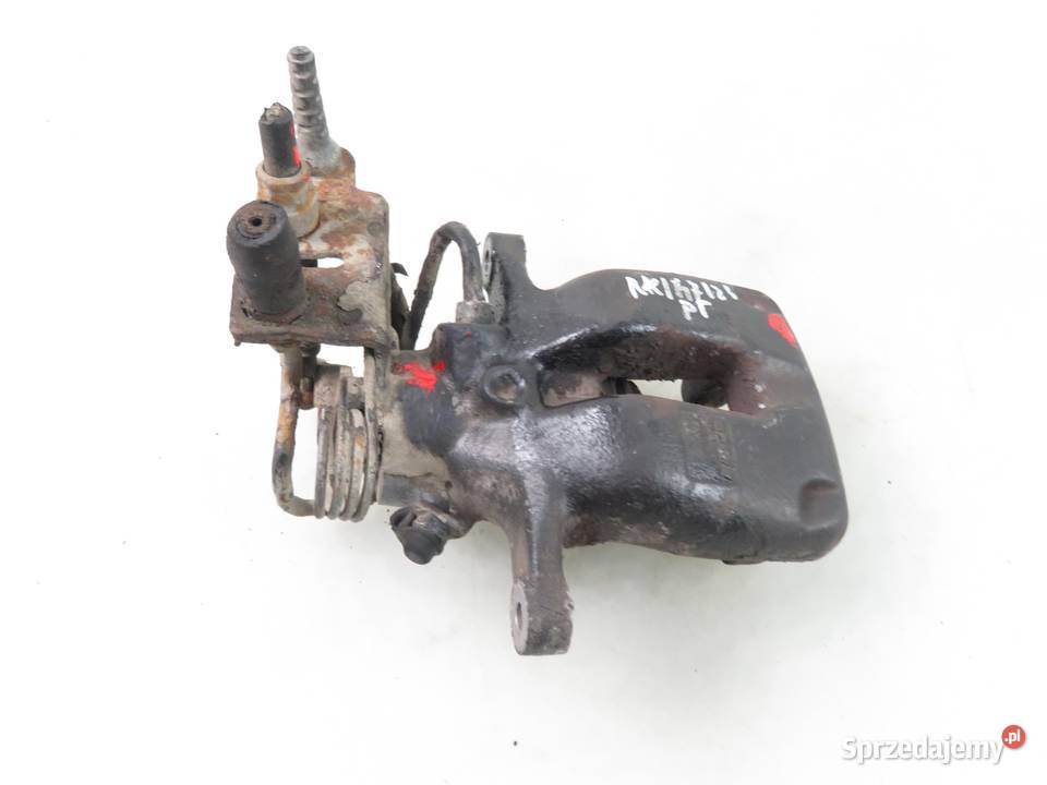 ZACISK PRAWY TYŁ VW CADDY III Motoryzacja