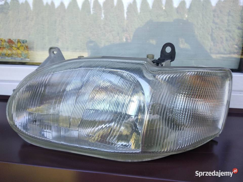 Ford Escort MK7 VII lampa przednia lewa Sieradz