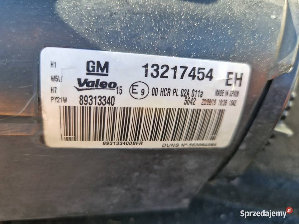 Opel Corsa D reflektor ORG EU Mielec