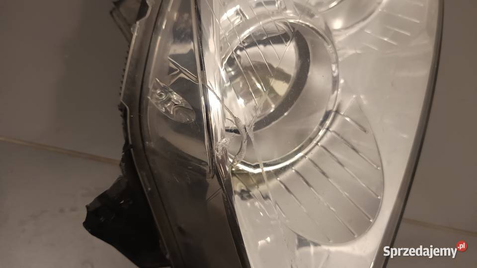 Lampa przednia lewa reflektor Opel Astra H 3 III