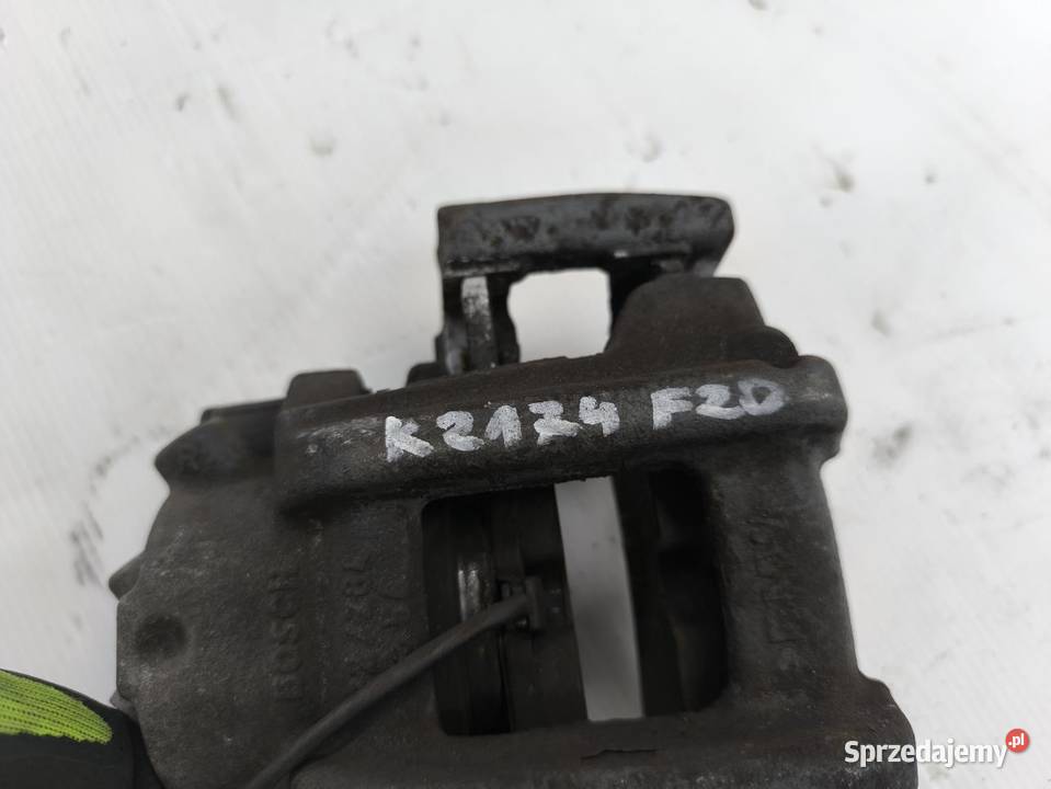 ZACISK LEWY PRZÓD BMW F20 F21 116i