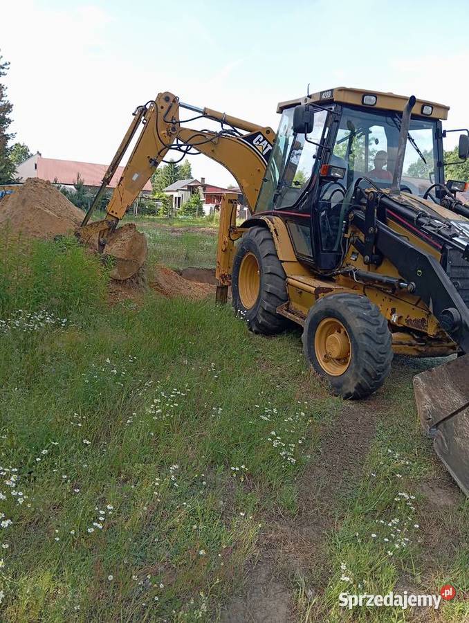 Usługi koparkoładowarką Cat 428D Pustków