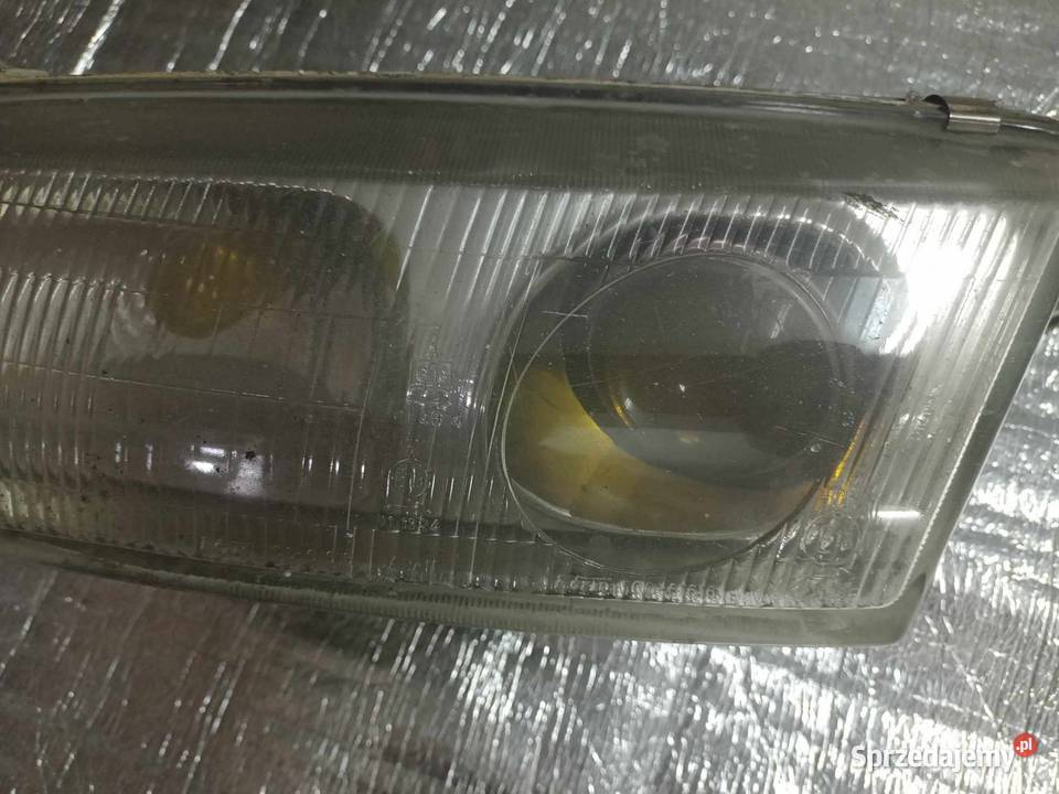 Mazda 626 lampa przód lewa ori Oświetlenie Rozprza