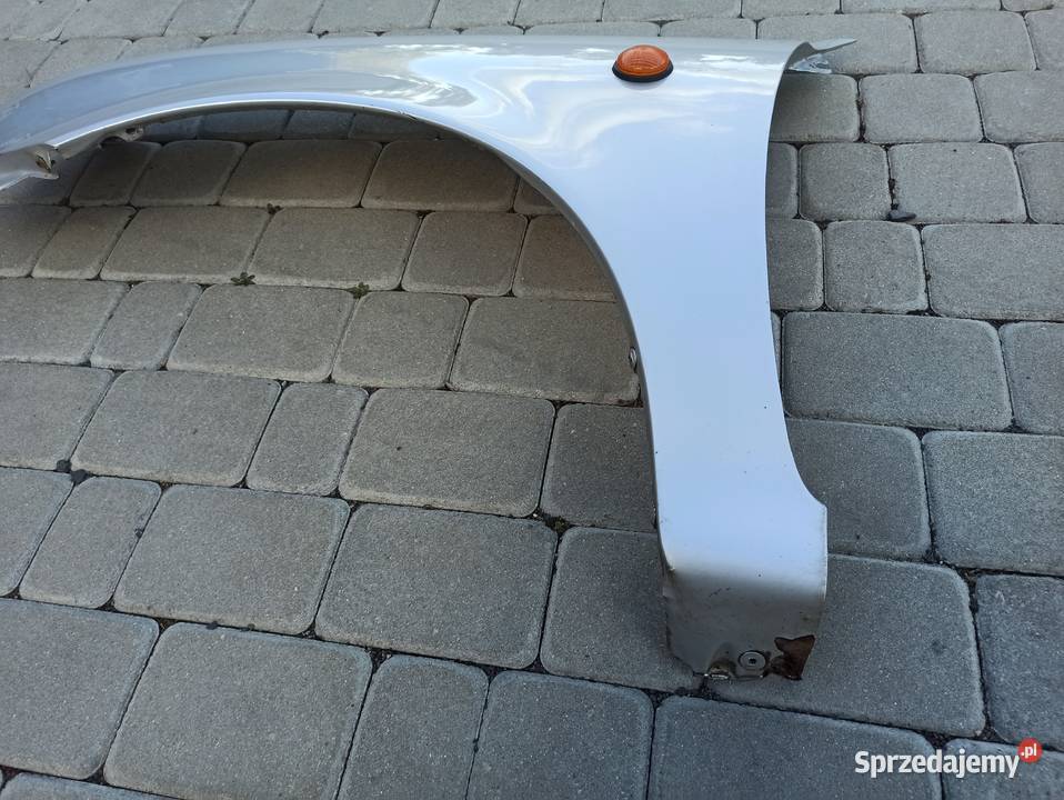 Nissan Micra K11 błotnik lewy przód srebrny sprzedam