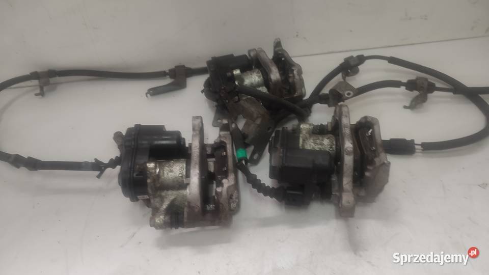 ZACISK TYŁ PRAWY LEWY ELEKTRYCZNY NISSAN QASHQAI Włoszczowa