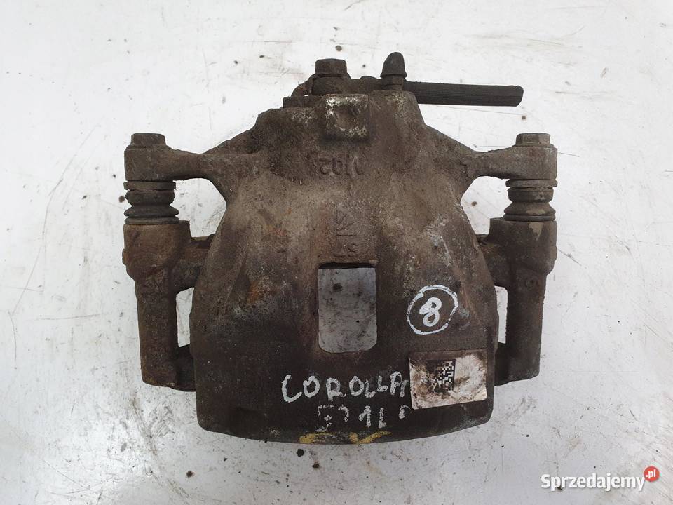 Toyota Corolla XII E21 LEWY PRZEDNI ZACISK Rudka