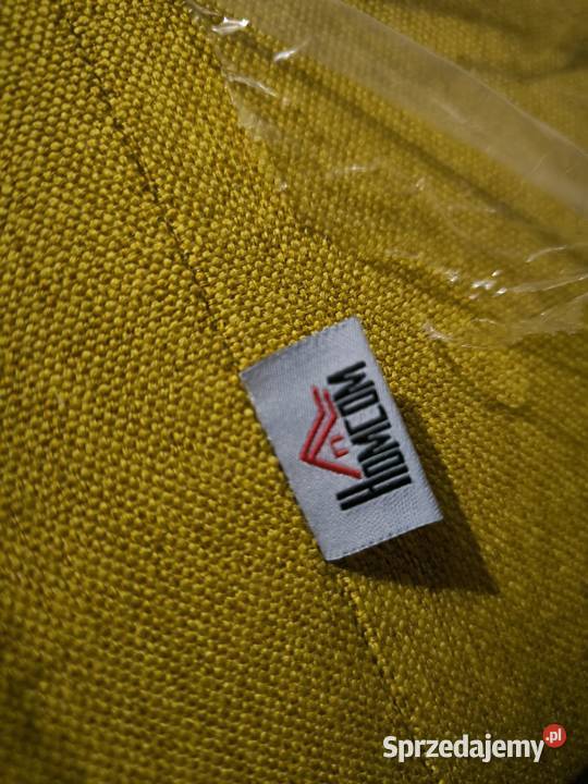 Nowoczesny żółty fotel z drewnianymi nóżkami