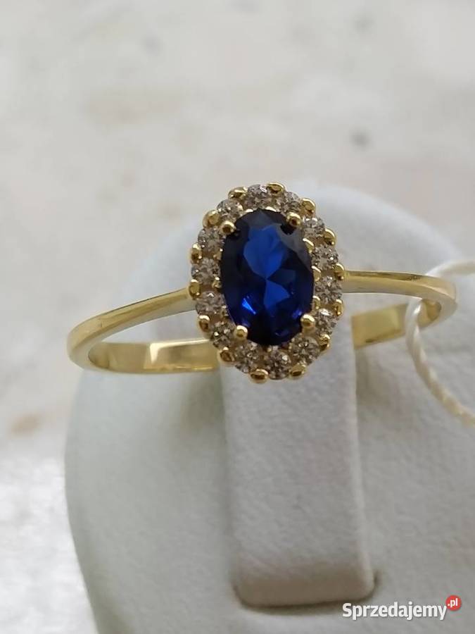 Złoty Nowy pierścionek z oczkiem koloru szafir i