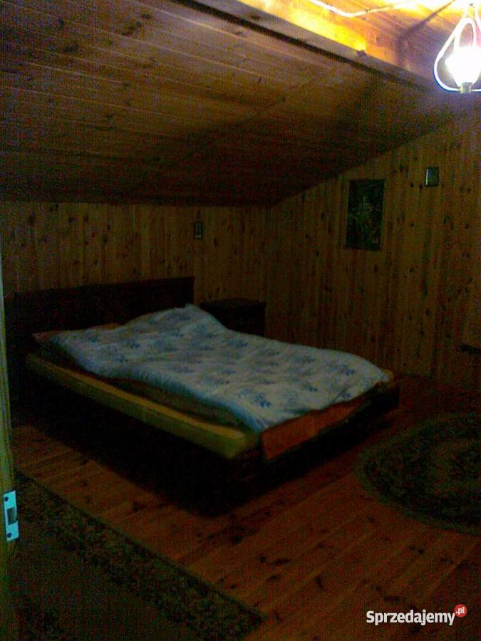 Drewnianomurowany dom Dzięciołkiem w bliskim sąs Szynkarzyzna