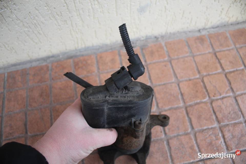 ZACISK HAMULCOWY LEWY TYŁ VW PASSAT B6 20 TDI