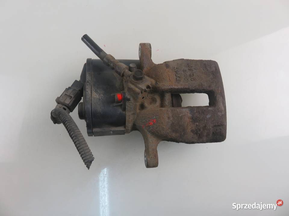 ZACISK LEWY TYŁ VW PASSAT B7 20 TDI