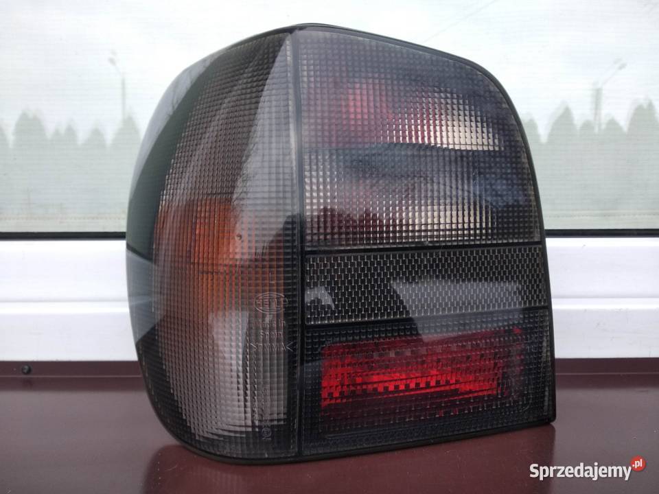 VW Polo III 6N lampy tył tylne Hella Black prawa Sieradz