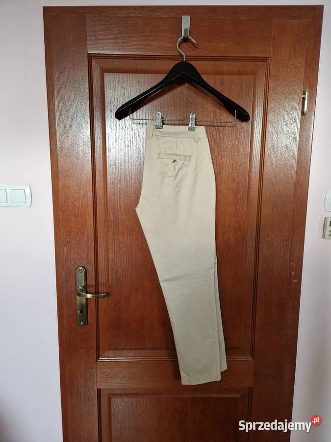 Nowe beżowe bawełniane spodnie damskie chinosy Next Bibice