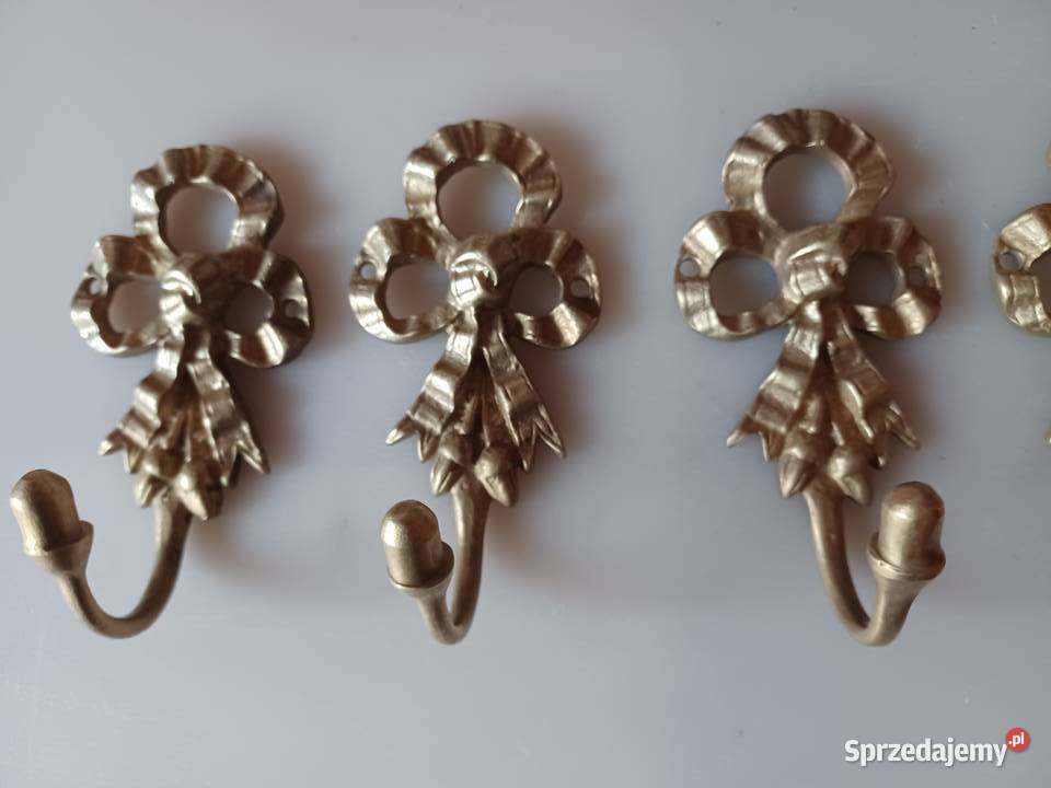 Komplet czterech pięknych mosiężnych wieszaków Poznań