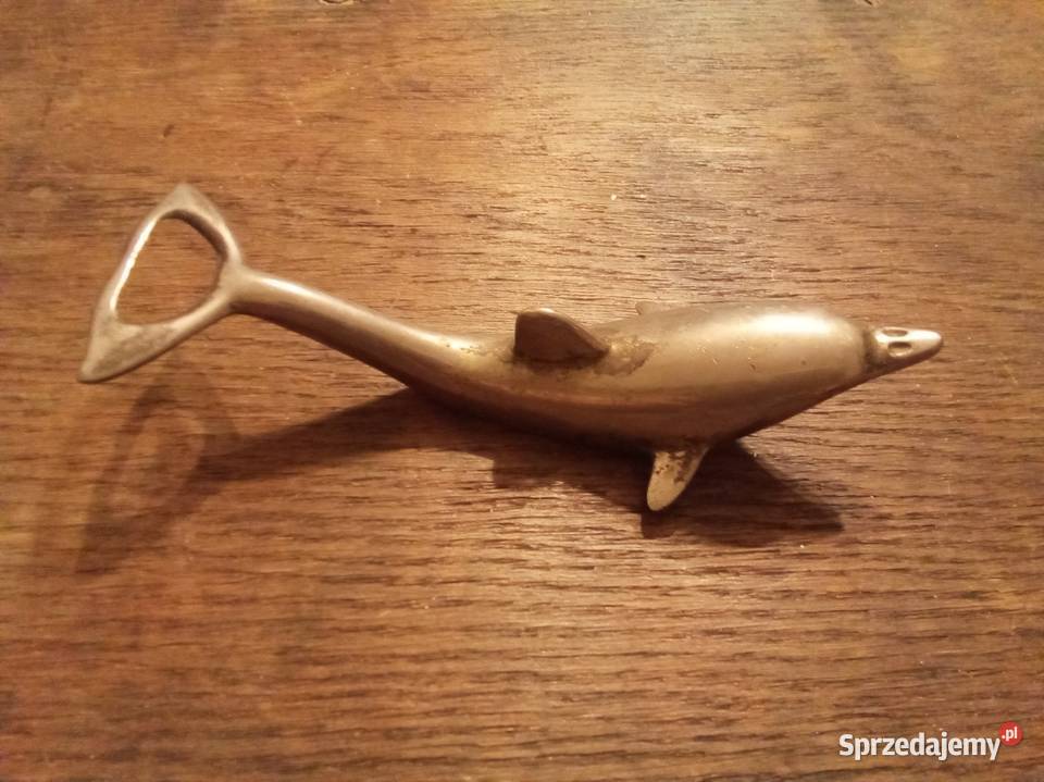 Stary otwieracz do butelek metalowy delfin PRL