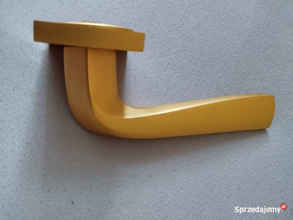 Klamka Adel na rozecie złoty mat Domino Szyld Olsztynek