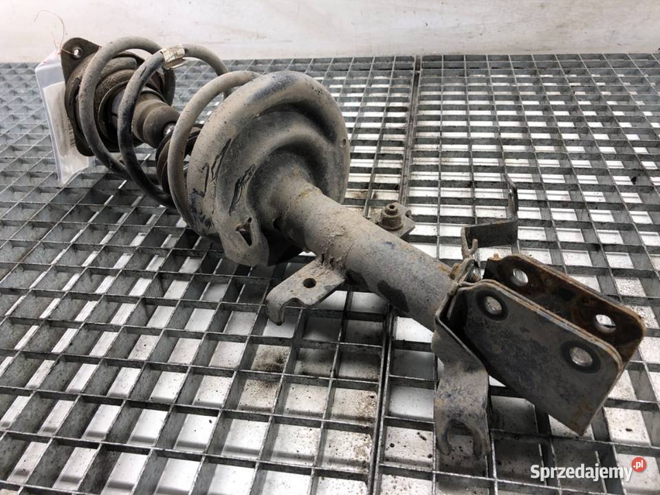 AMORTYZATOR LEWY PRZÓD ZE SPRĘŻYNĄ RENAULT CLIO