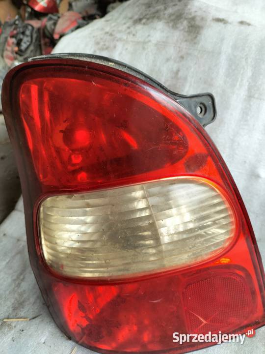 KIA CARNIVAL I LAMPA TYŁ TYLNA LEWA Kamień-Kolonia