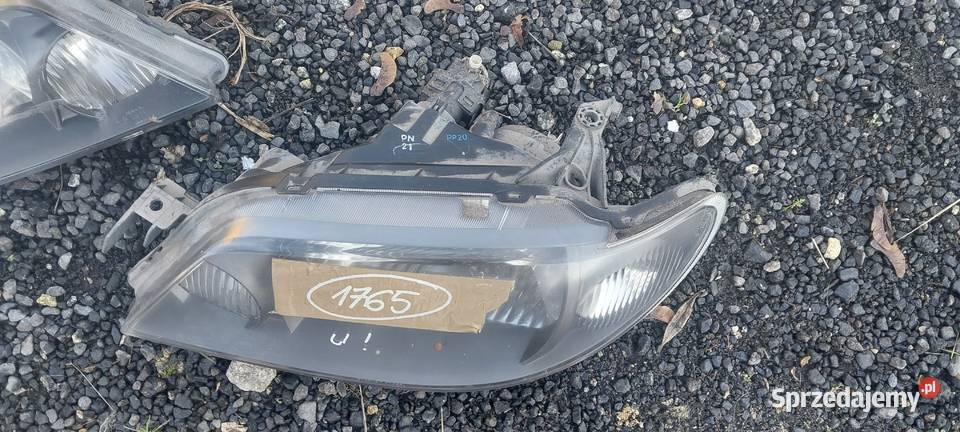 Mazda 323 f 2002 2003 lampa prawa lewa Oświetlenie Byków