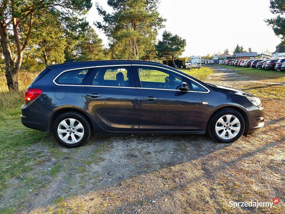 Opel Astra 14 TURBOClimatronicAluNaviPełna czujnik zmierzchu Samochody osobowe Piła