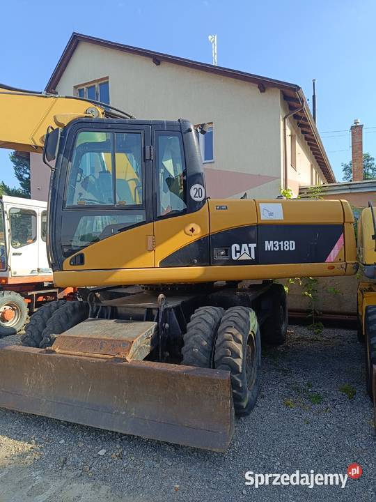 CAT M318D kołowa koparka produkcji 2009 Nisko