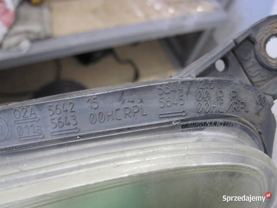 OPEL CORSA D lampa lewa przód 89391389 89391377