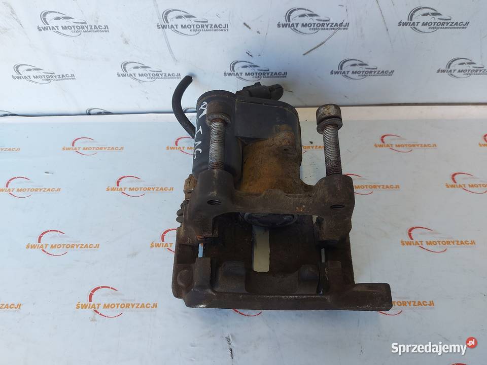 VW PASSAT 13r zacisk hamulcowy lewy tył 5078H