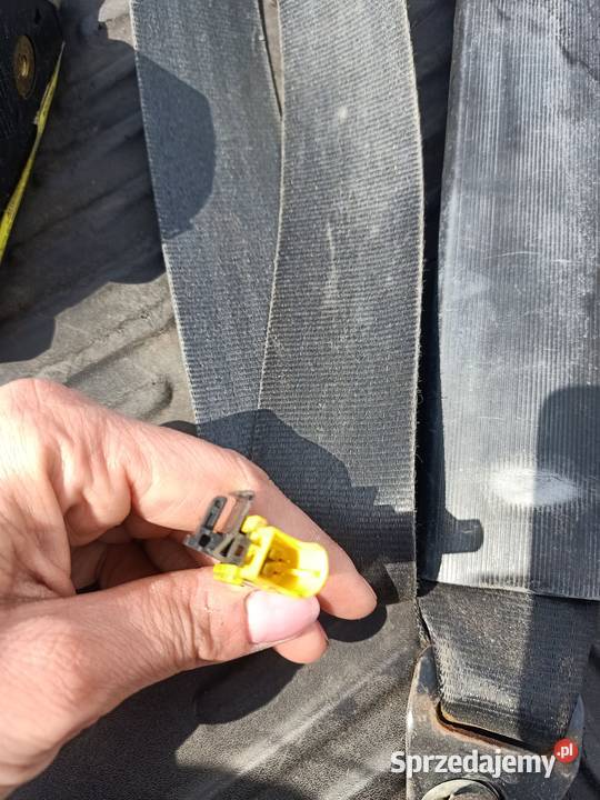 Pas bezpieczeństwa napinacz lewy przód Fiat Szczecin