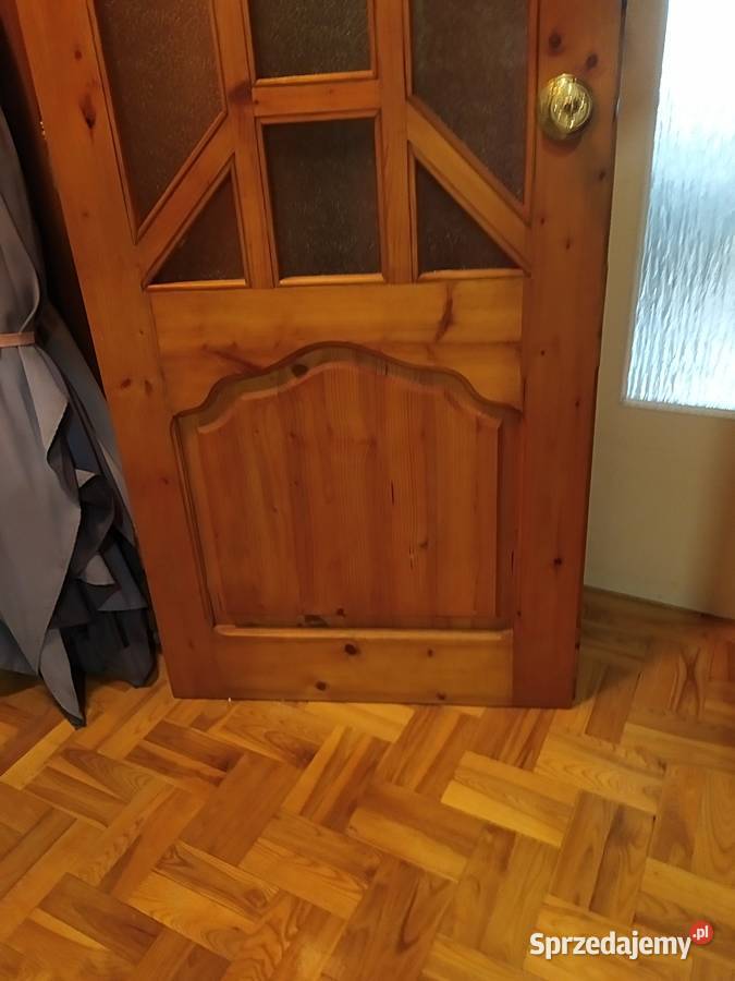 Drzwi z litego drewna z półłukiem robione na Kraków