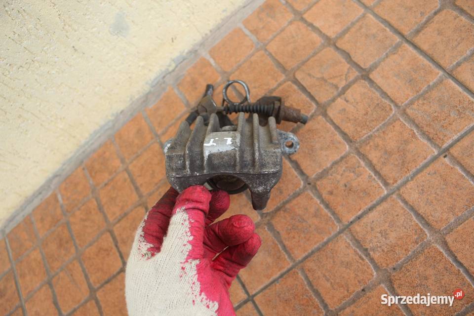 ZACISK HAMULCOWY LEWY TYŁ AUDI A4 B6 25 TDI