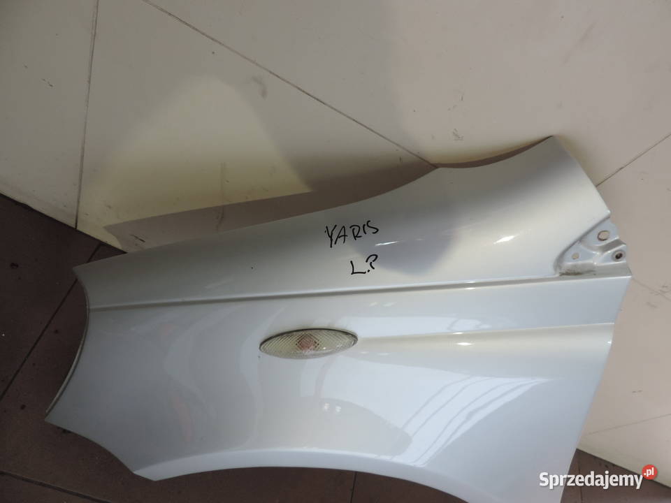 BŁOTNIK LEWY PRZÓD TOYOTA YARIS 1 FL KOLOR 1E7 Nowy Sącz
