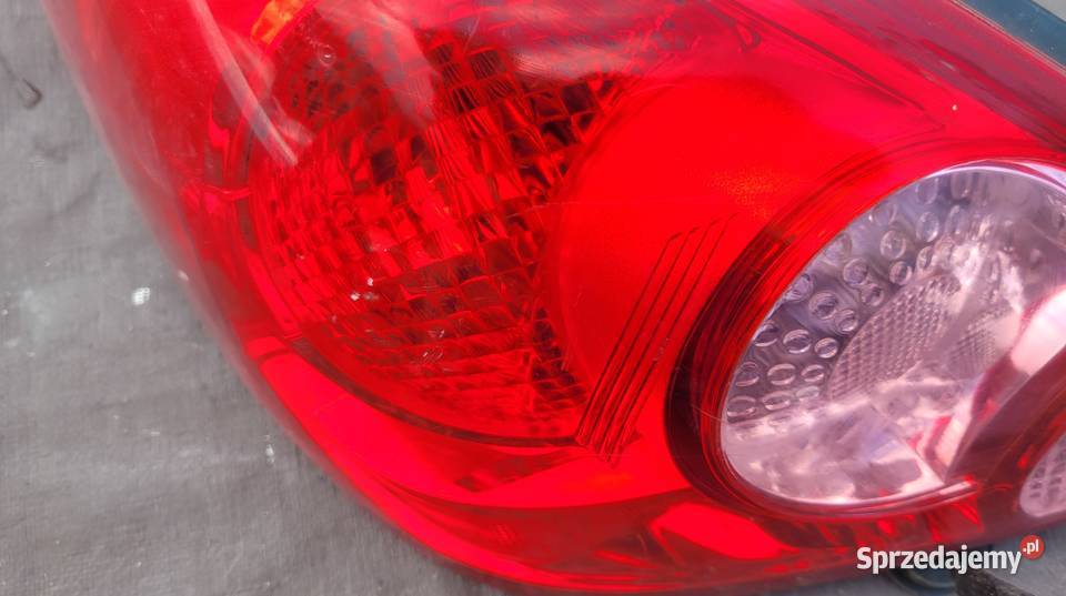 NISSAN TIIDA 5D LAMPA TYŁ LEWA 26555EM01A HELLA Ruda Śląska
