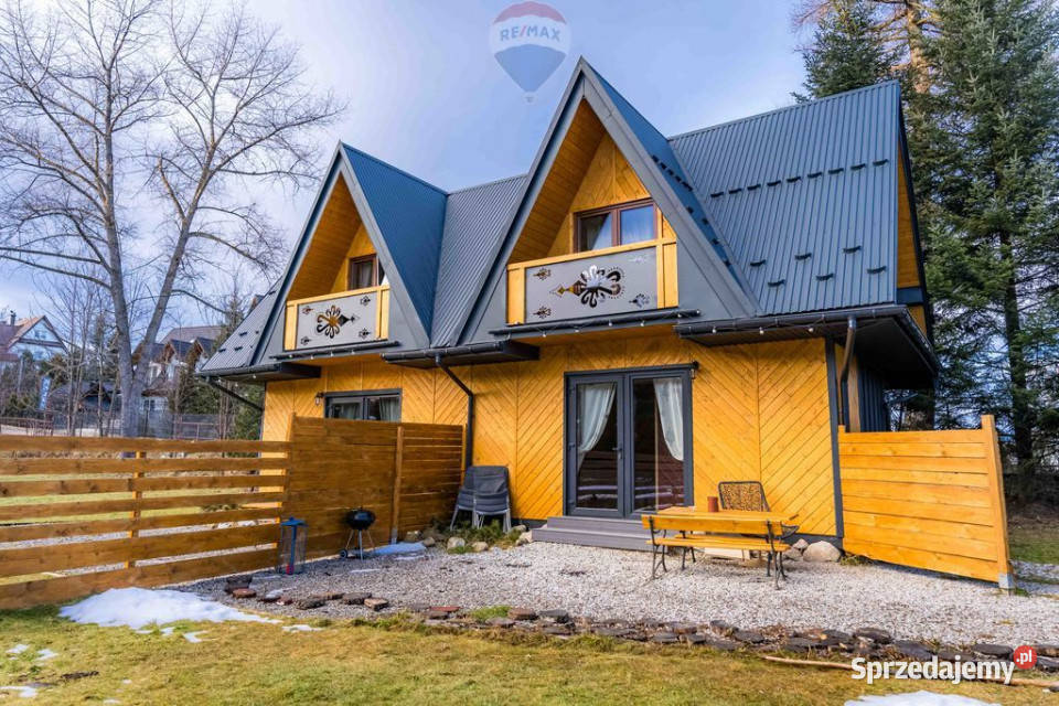 Działka zabudowana drewnianym domem w sprzedam